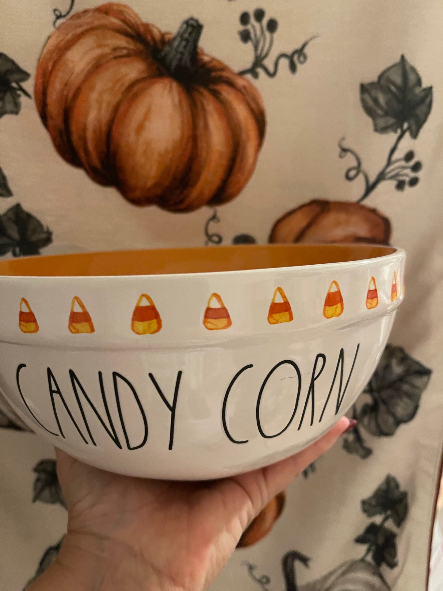 Rae Dunn Candy Corn Small Bowl with Candy Corn on side of bowl and orange inside