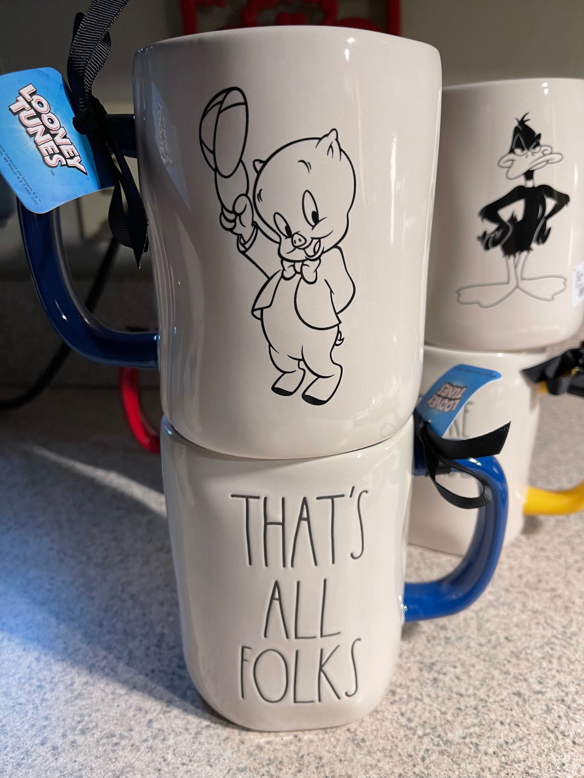 Rae Dunn That's All Folks with Porky Pig Image on back of mug, blue handle and blue inside