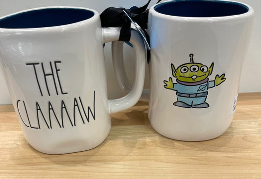 Rae Dunn Toy Story The Claaaaw Image and Black Inside Cup with Black Lettering