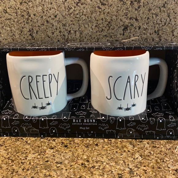 Rae Dunn Creepy and Scary Mug Set with hanging spiders under title 