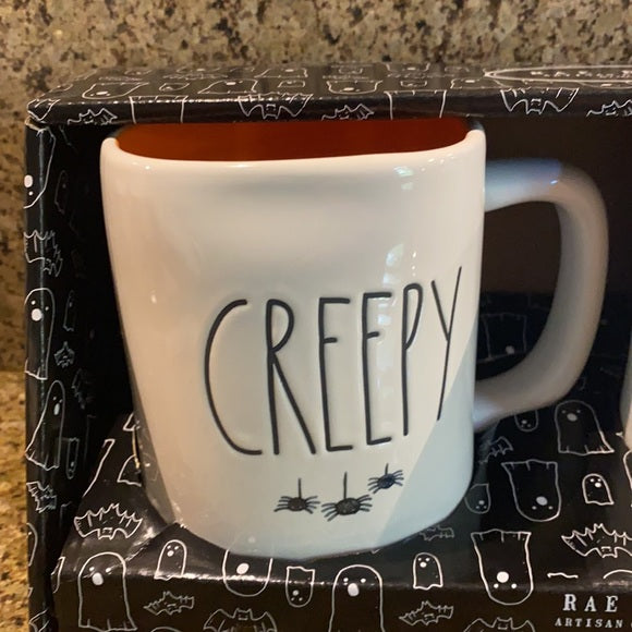 Rae Dunn Creepy and Scary Mug Set with hanging spiders under title 